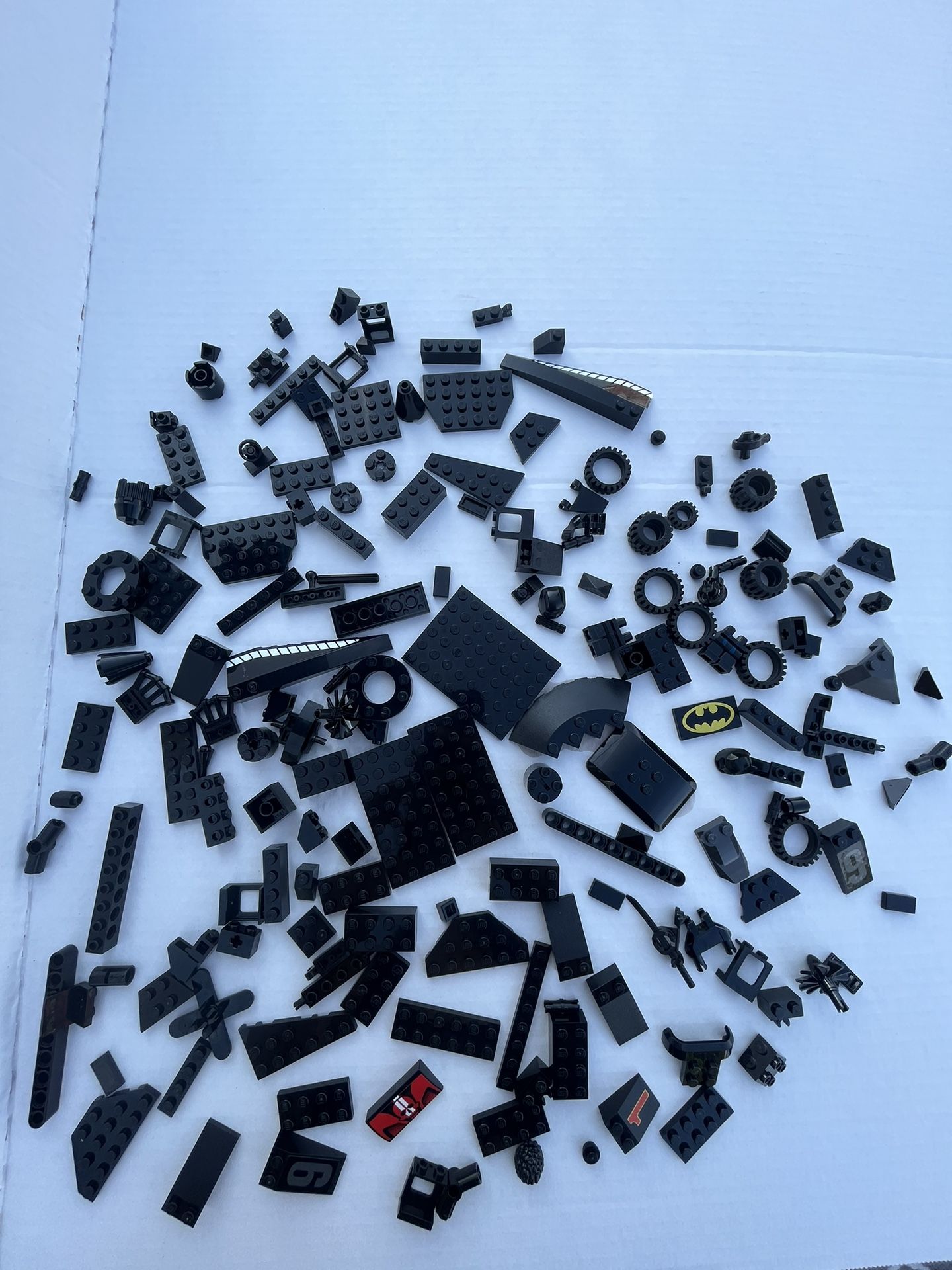182 Black Lego parts and pieces. Clean and Sanitized