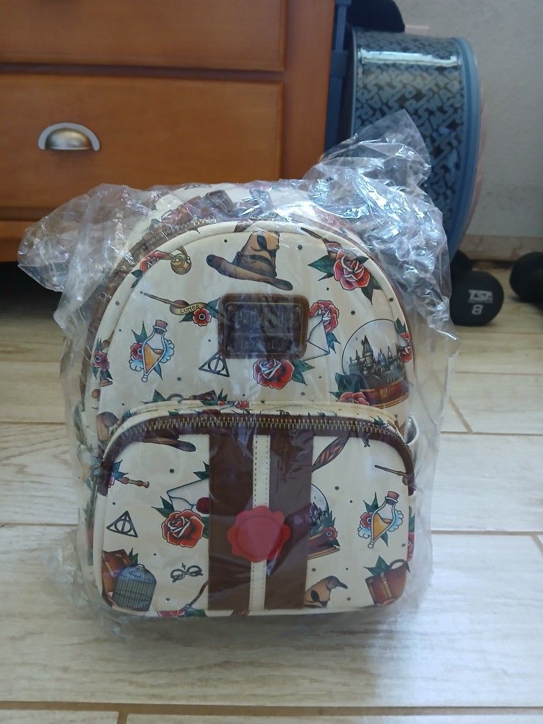 BRAND NEW. NEVER USED. HP Loungefly MINI Bag