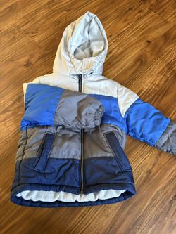 Boys size 7 Oshkosh heavy winter jacket. Very, very warm.