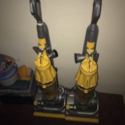 Two Dyson Vacuums