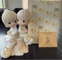 Precious moments figurine- love one another
