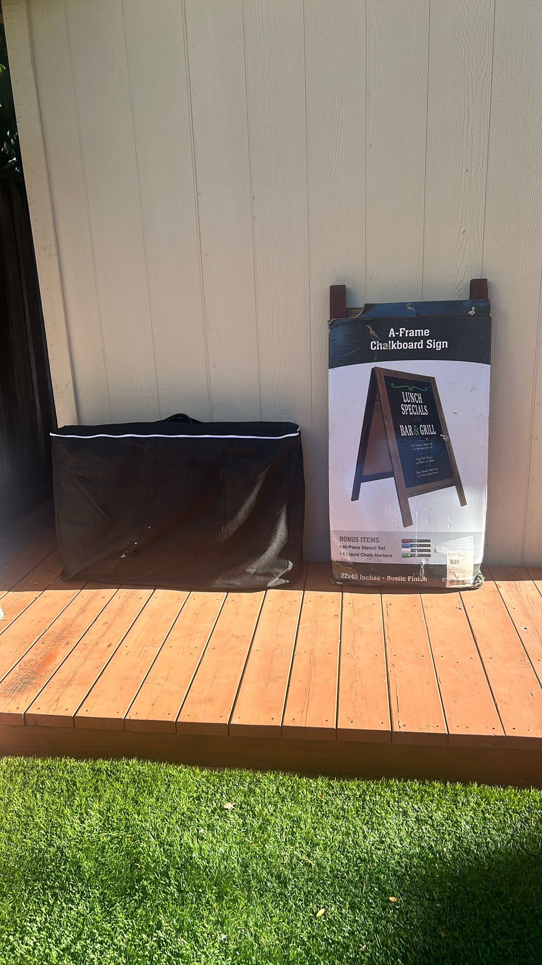 Massage Table And Chalkboard Sign