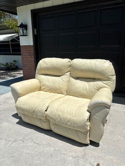 Cream Leather Reclining Loveseat
