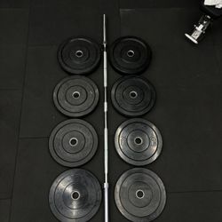 Olympic Barbell (700 lb Capacity) + 230 lb Virgin Rubber Weight Plate Set