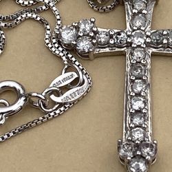  diamond encrusted cross pendant.. stamped 925 silver...