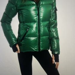 Green puffer jacket with black accents