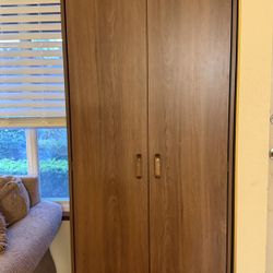 Tall wood cabinet with shelves