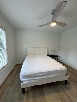 White Upholstered Queen Bed Frame with Channel Tufted Headboard