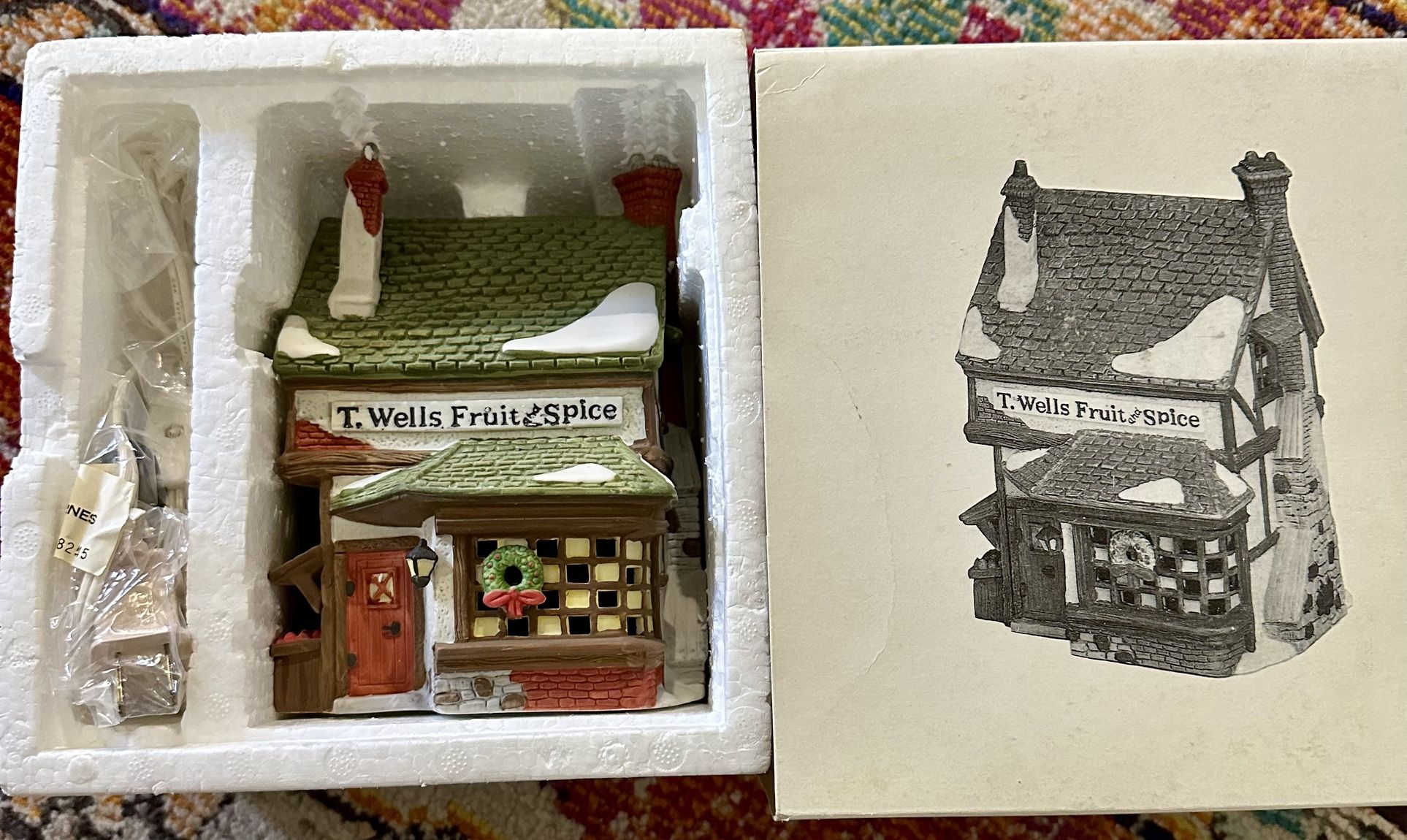 Dept. 56 Heritage Village Collection – Dickens’ Village Series “T. Wells Fruit & Spice Shop” – 1988 Hand-painted porcelain. Includes original box, Sty