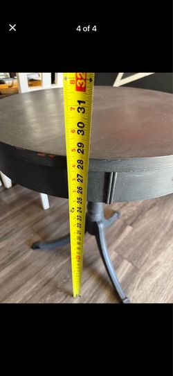 Gray pedestial round table