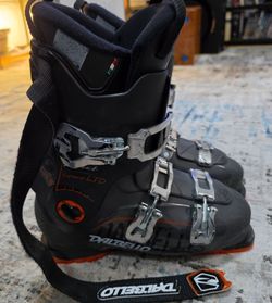 Dalbello Aspire Sport LTD alpine ski boots in black with orange accents. Comfortable recreational/all-mountain boot featuring a 4-buckle closure syste