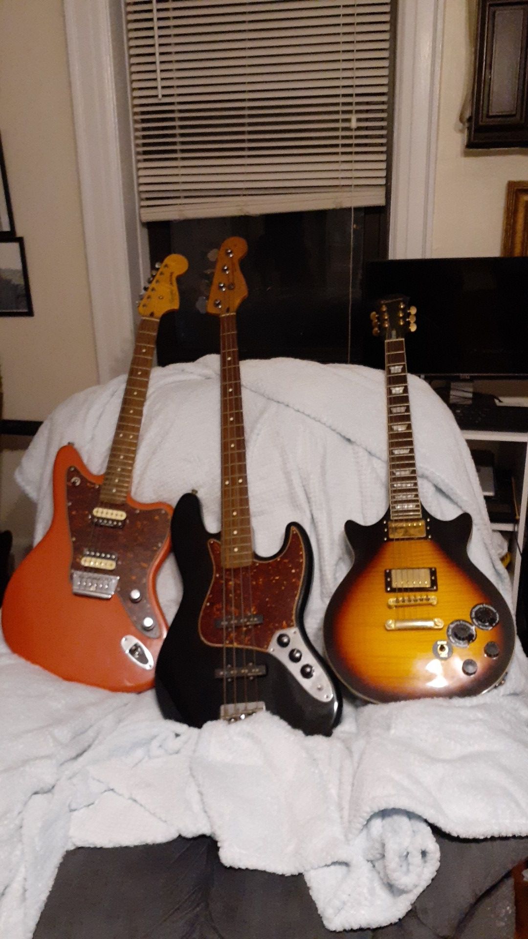 2 guitars and a Fender bass