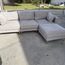 Modern L shape gray sofa with gold legs 