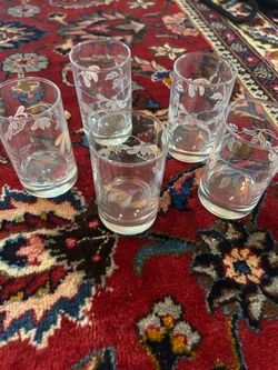 Set a five Corning Corelle glasses in the "Pink Trio" pattern