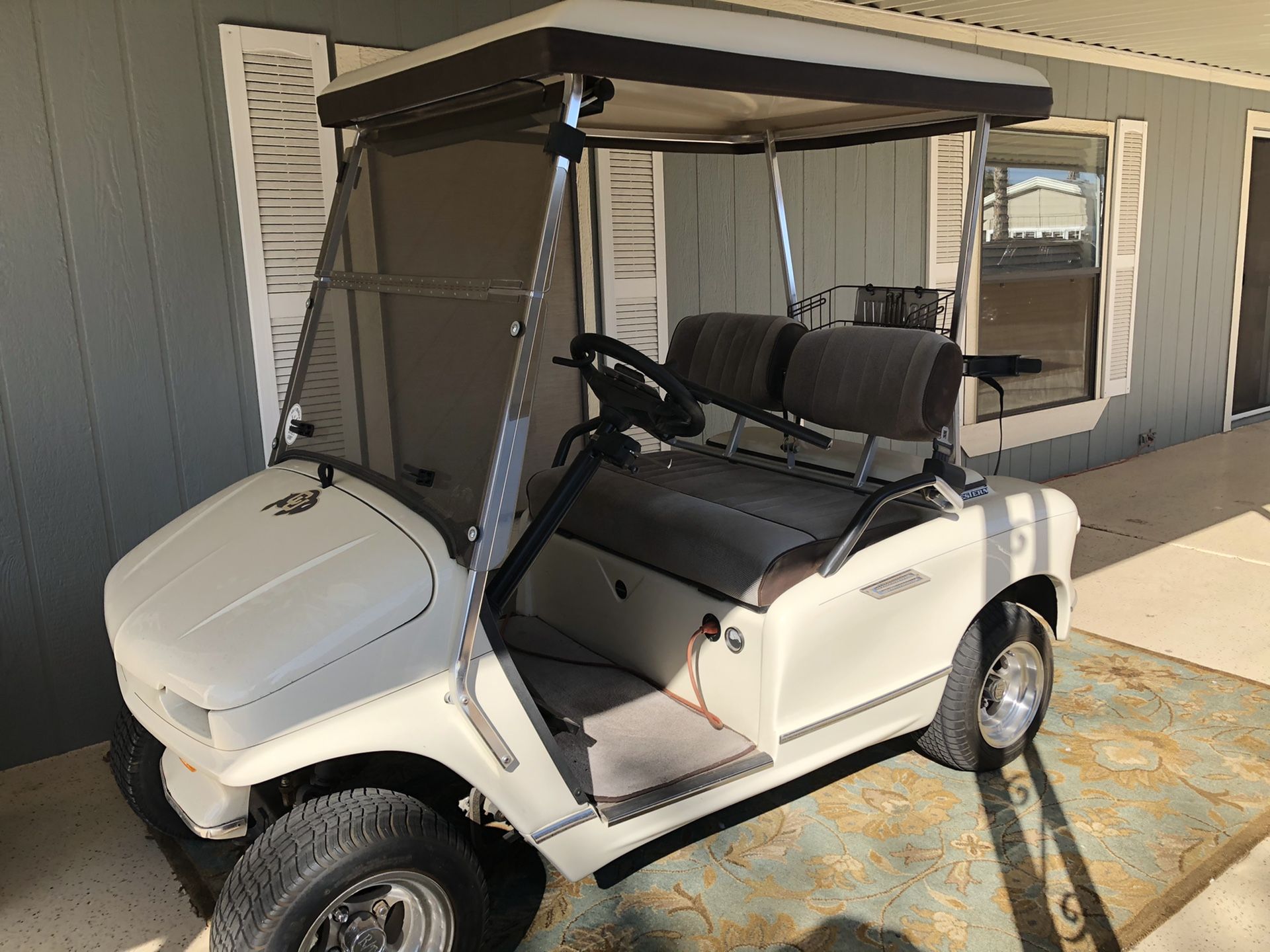 Golf cart. Western (EZGO). Built in transformer. Built in cooling area. Batteries and tires and wheels are only three years old. Seat cover redone.