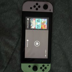 Nintendo Switch Black With Purple And Green Joy Cons