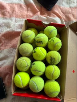 28 lightly used tennis balls