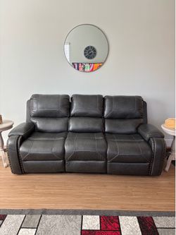 Reclining couch and chair grey color very nice great condition from American furniture warehouse, only 2 yrs old. Non smokers, no pets, no kids. Easy