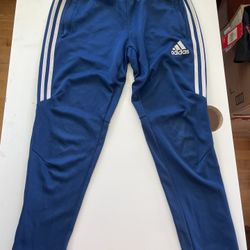 Adidas blue joggers with white stripes  Size: S  🚚 Ships fast – usually same or next day 🔥 Bundle & save – DM for deals on 2+ items!