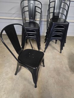 Stackable metal chairs 8 in total