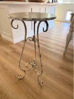 Small distressed metal stand