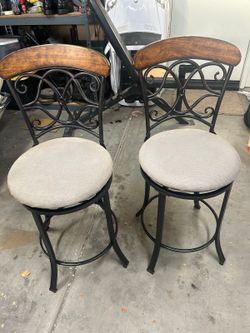 Pair of swivel bar chairs