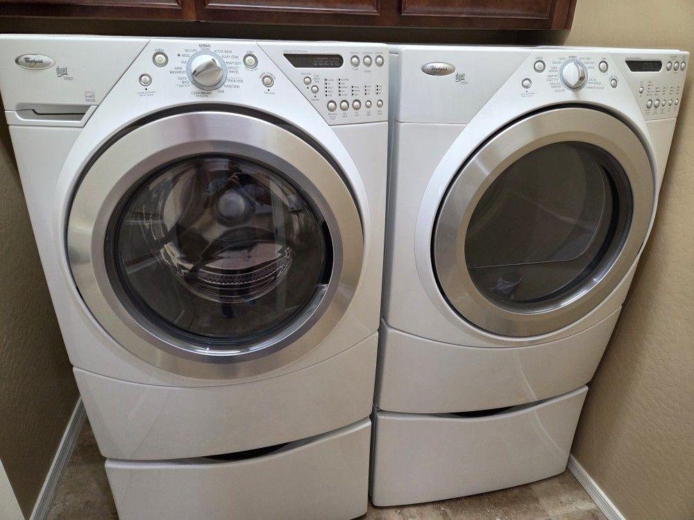 Whirlpool Duet Steam Front Load Electric Washer and Dryer with Pedestals.