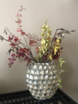 Shell vase with faux orchids