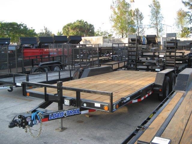 18’ equipment hauler/ heavy duty kicker ramps/brakes / stained and sealed deck / 5 year warranty