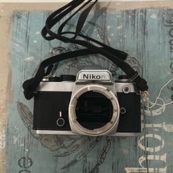 Chrome Nikon FE SLR film camera; body only, lens is not included - Very