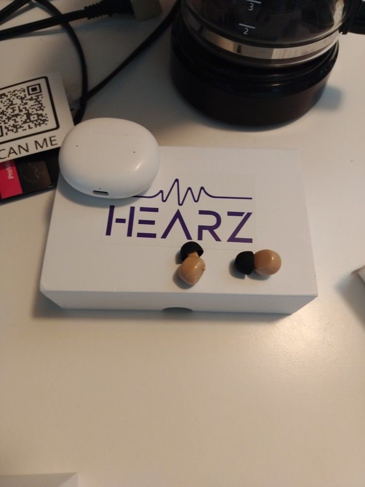 Hearz Hearing Aids With The Charger And The Units In The Extra Pieces For The Hearing Aids
