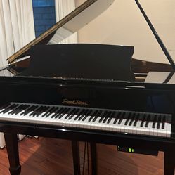 Baby grand piano with player. system. like new