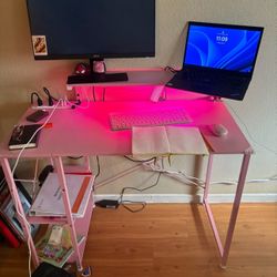 pink desk with outlets and lights