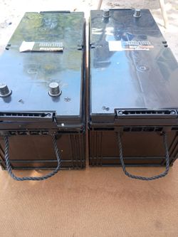 Two power King1400CCA 200 AH , both have green lights and are in fully charged condition marine batteries sold in a pair