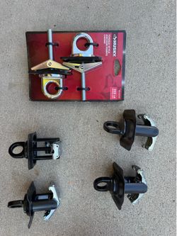 Truck bed stake pocket tie down anchors.