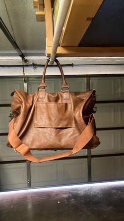 Leather carry on  bag with shoulder strap. Well taken care of allowed as carry on baggage