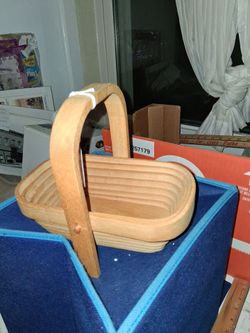 A small wooden collapsible basket