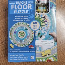 NEW IN BOX Melissa & Doug Round the Shore Tracks Cardboard Jigsaw Floor Puzzle and Wind-Up Vehicles – 48 Pieces, for Boys and Girls 4+.
