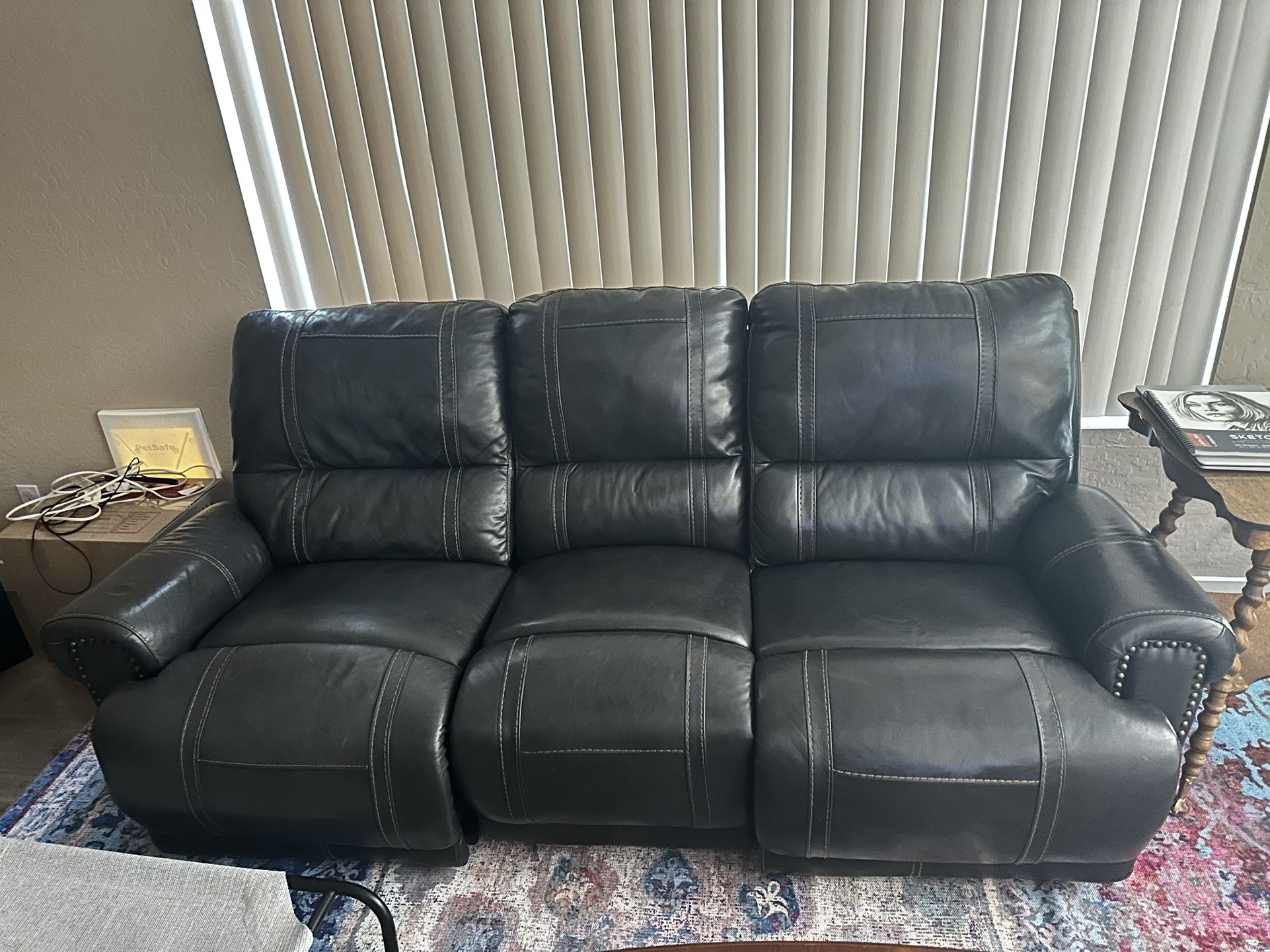 LEATHER COUCH WITH RECLINERS AT BOTH ENDS