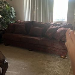 Beautiful Burgundy Couches With Paintings To Match