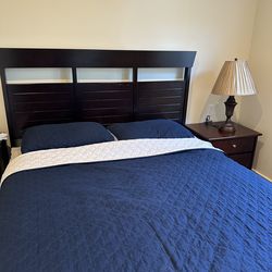 Solid wood queen bed frame with nightstand and lamp