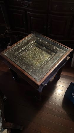 Wooden side table hand carved with metal plating