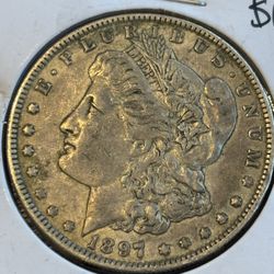 1897-O Morgan Silver Dollar – $85 Firm (New Orleans Mint)