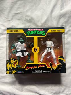 Teenage Mutant Ninja Turtles VS. Cobra Kai Michelangelo & Daniel Larusso Figures