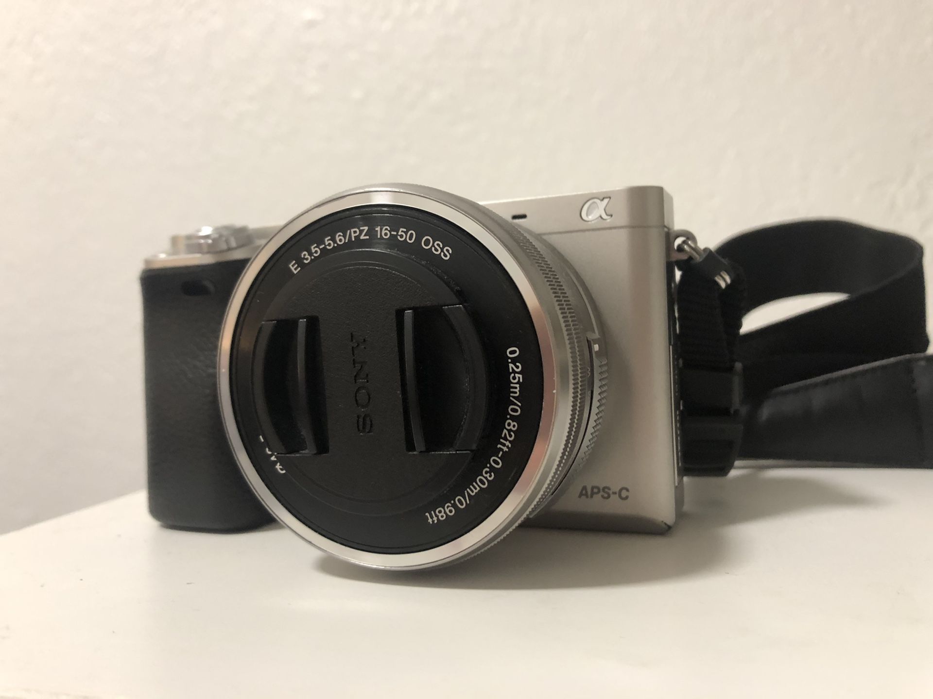 Sony a6000 mirrorless camera with 16-50mm kit lens and accessories