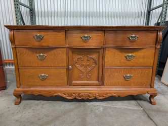 Vintage Carved Wood Dresser with Ornate Brass-Toned Hardware