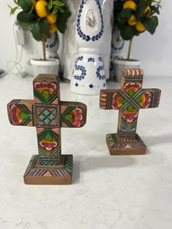 Small super cute hand-Painted Wooden  Cross on Stand. Each one is $22 dollars .