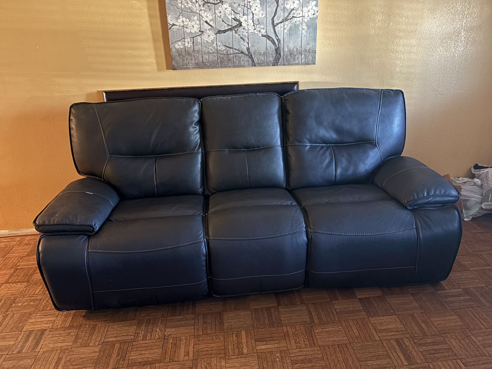 Marcus Black powered reclining sofa with USB charging ports living spaces