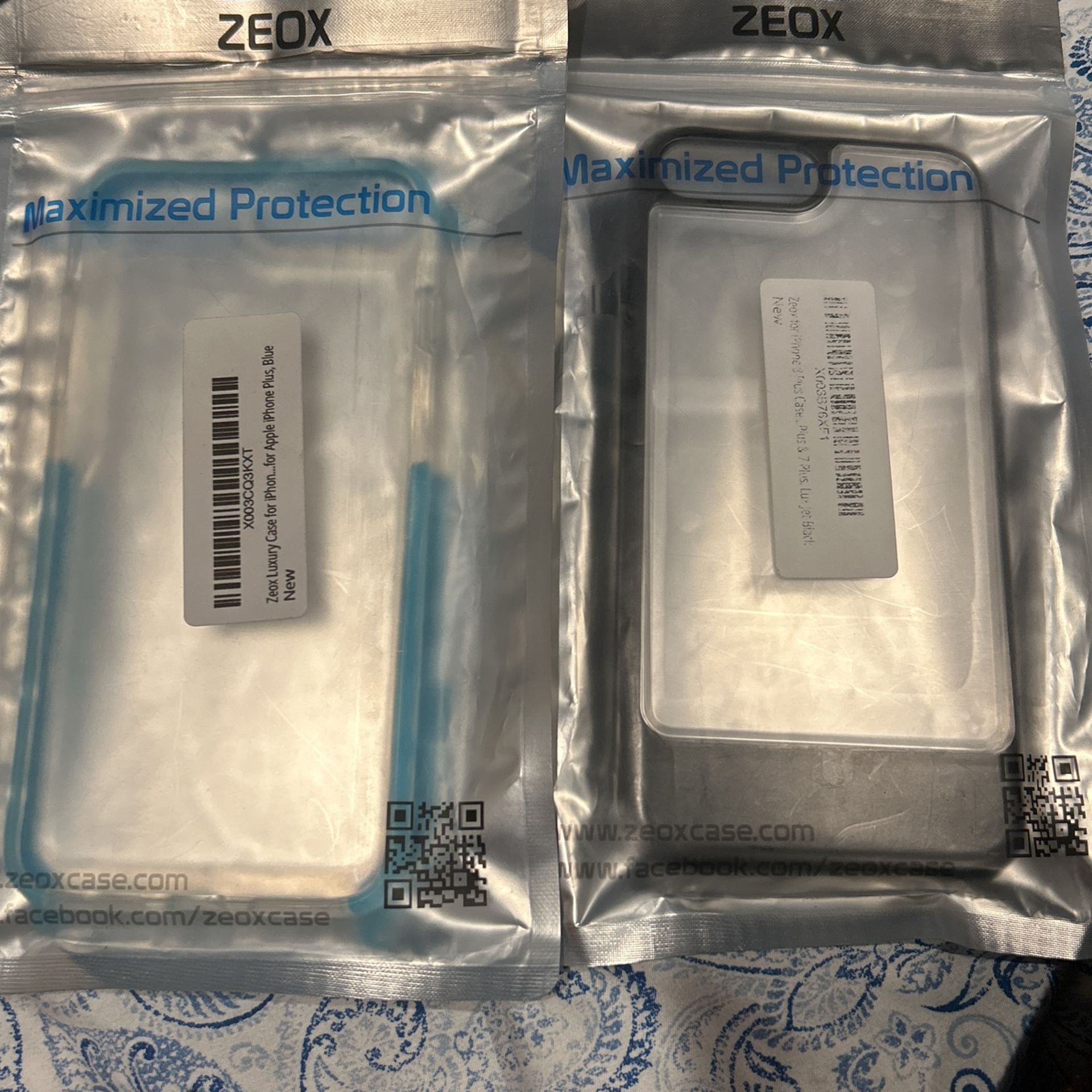 2 iPhone Plus Cases (blue) And (black) $5 Each