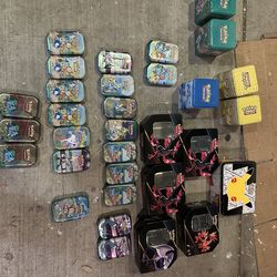 Lot of empty pokemon tins.